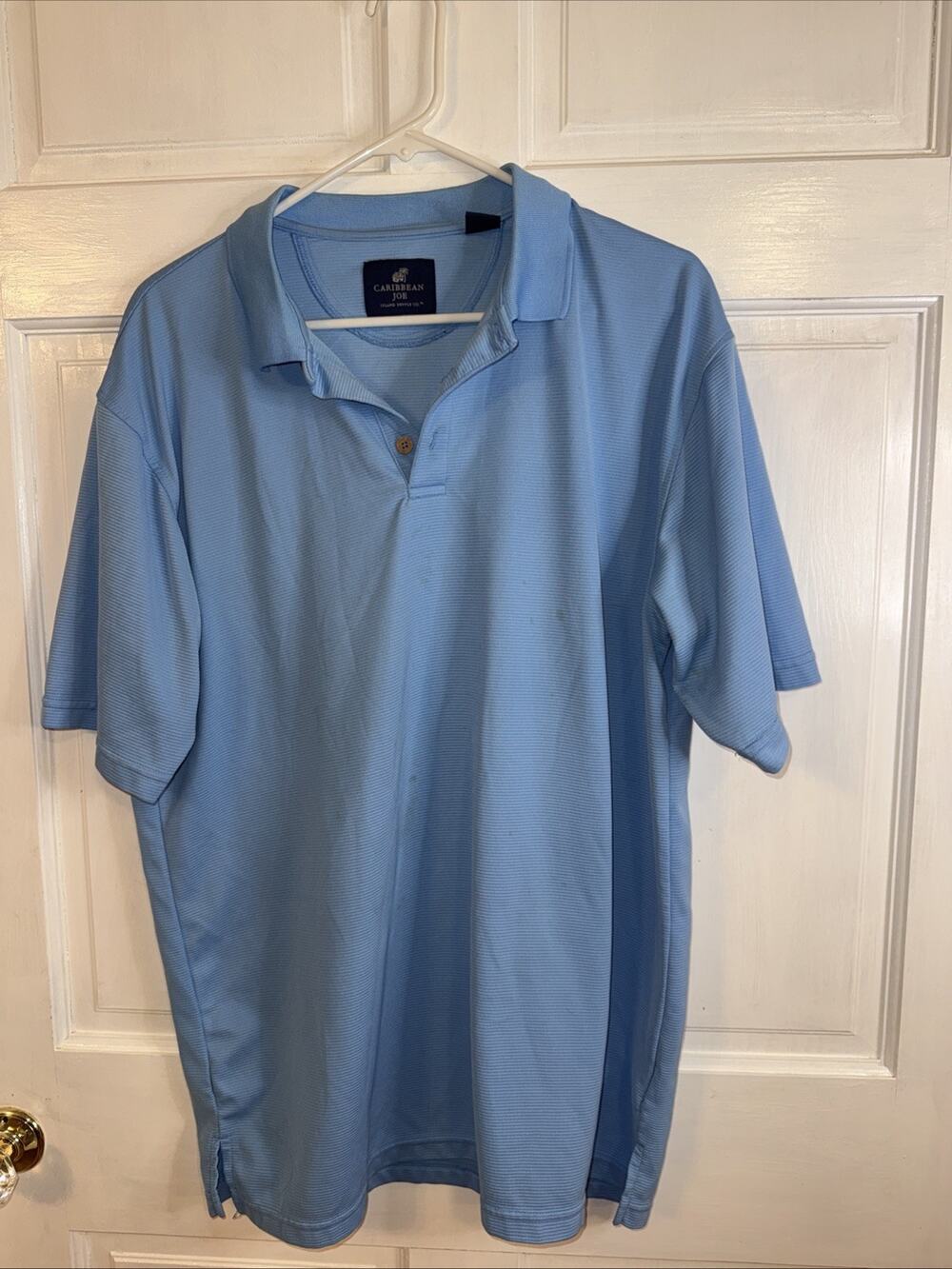 light blue Caribbean Joe short-sleeved polo shirt. Large FLAW